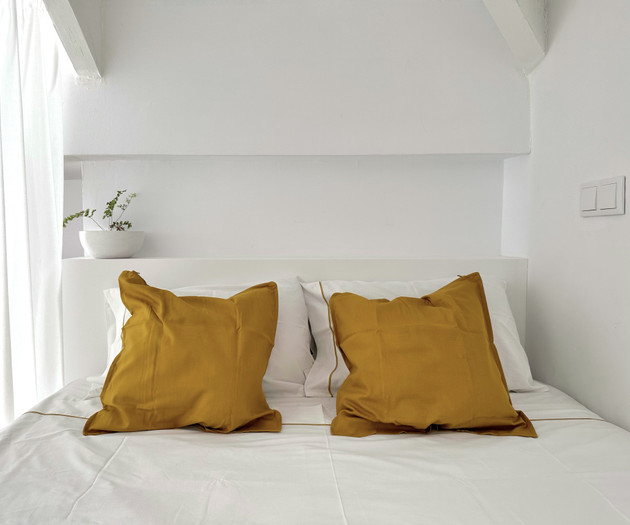 Bedroom pillows against headboard