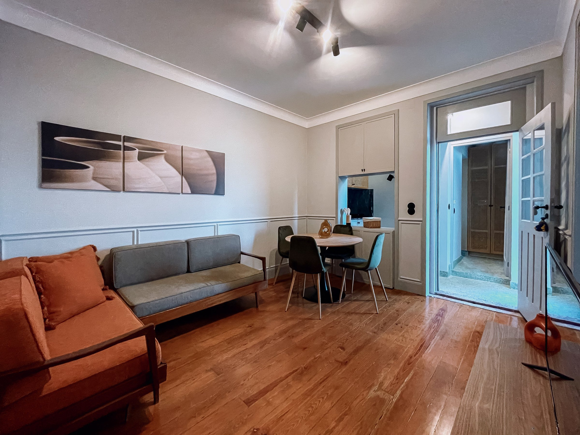 Bright living room with orange sofa