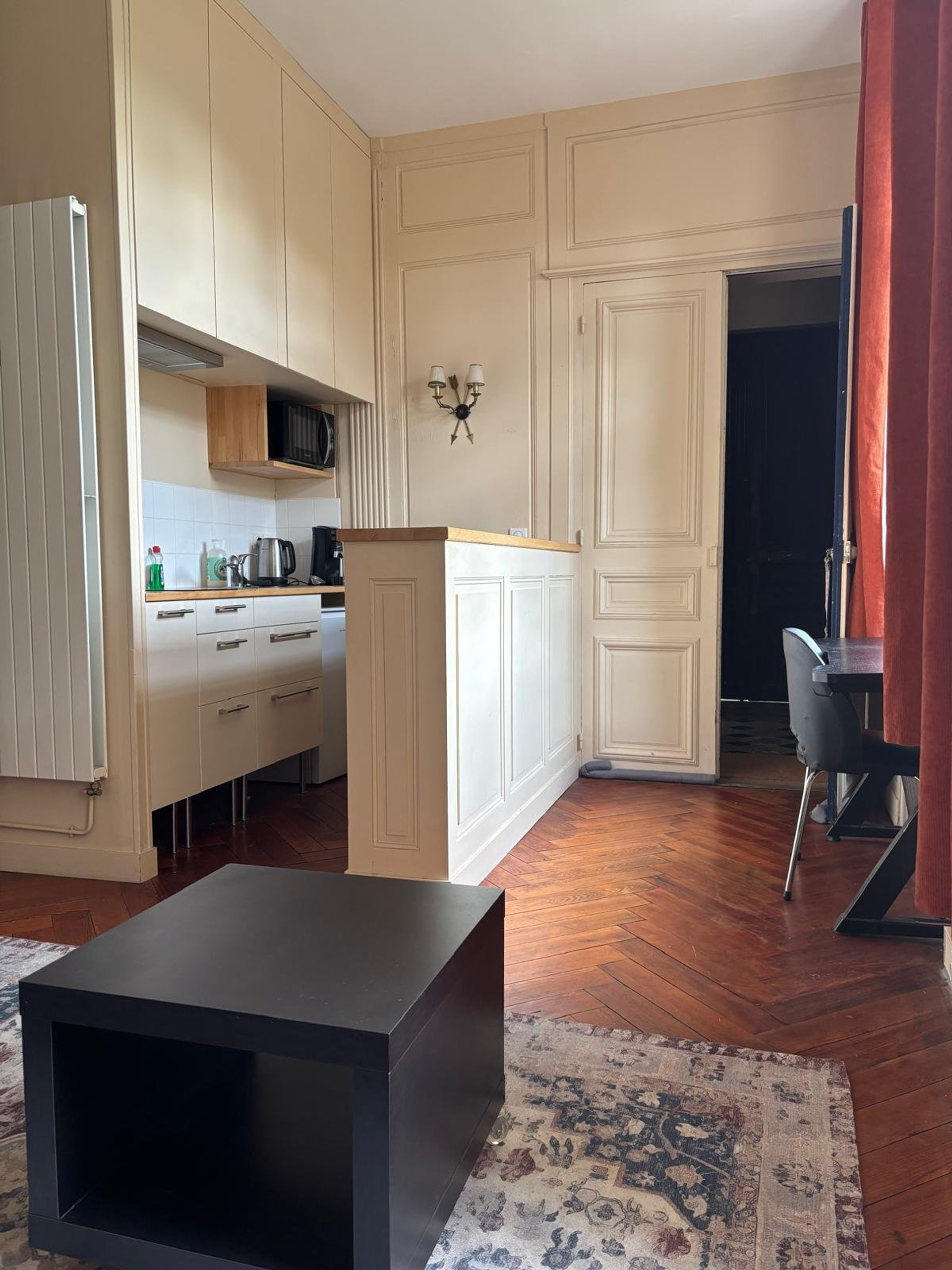 Kitchenette with cabinets and counter