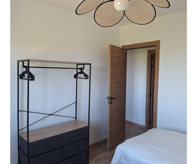 Bedroom three with rack