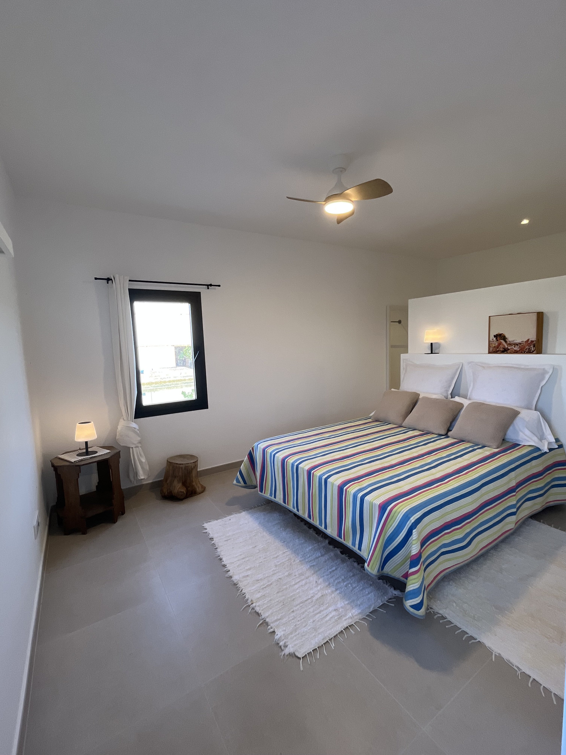 Master bedroom wide angle striped bedding