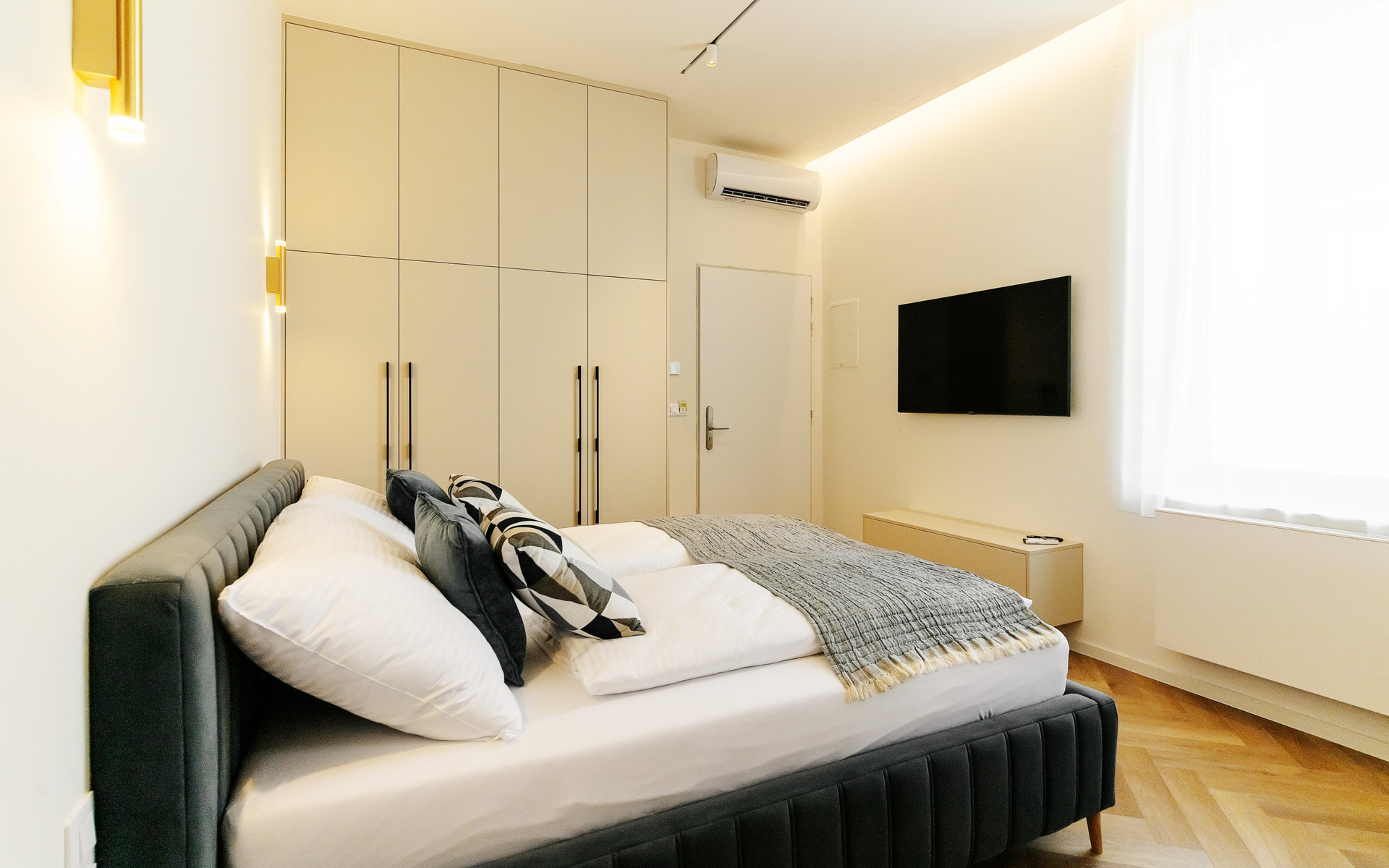 Bedroom with wardrobe and TV