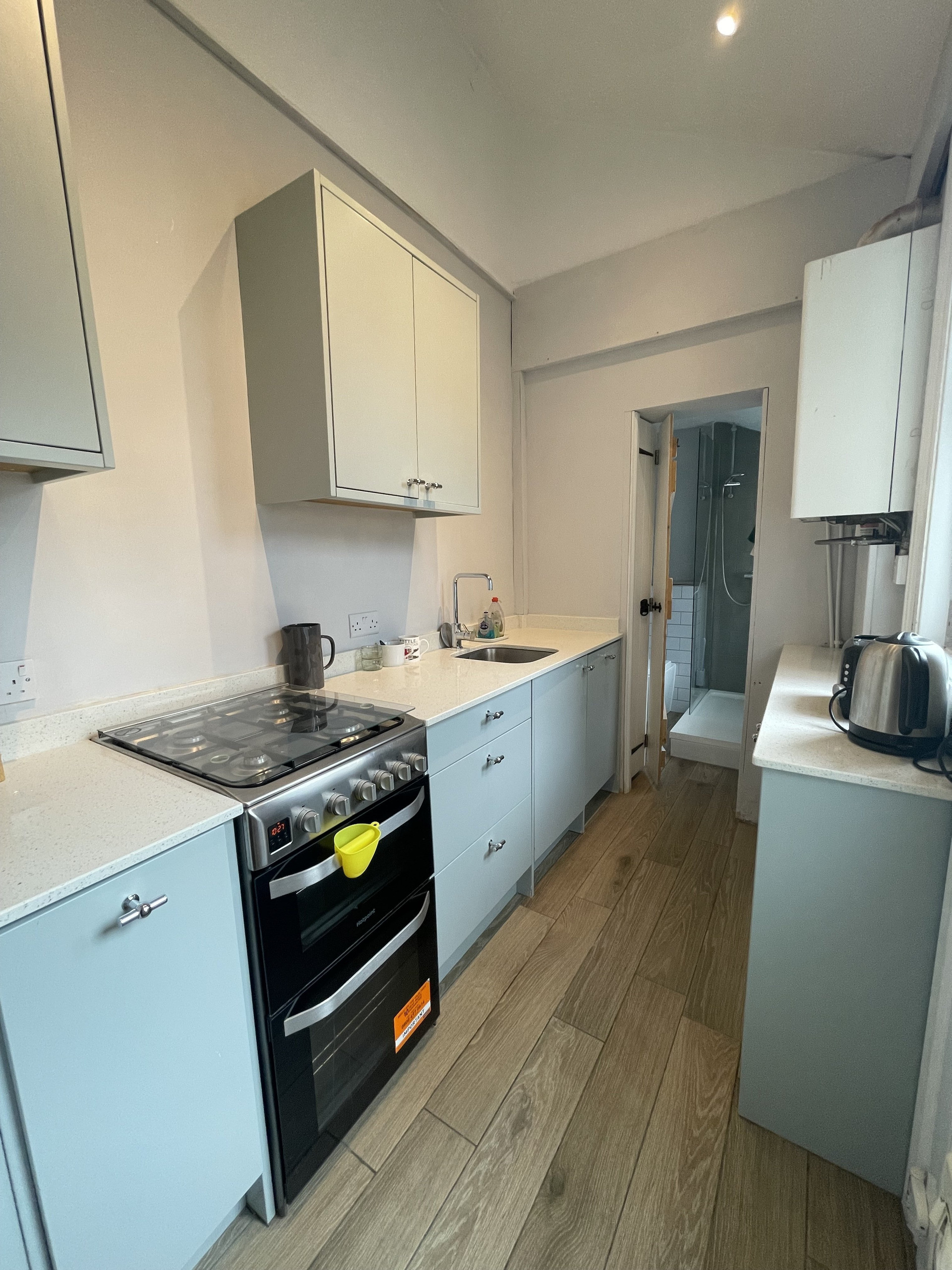 Light-filled and modern galley kitchen, with kitchenware (kettle, tableware, utensils), good storage, undermount sink and Hotpoint dishwasher, alongside 220l frost-free fridge freezer. Reliable warmth from energy efficient A-rated Worcester boiler installed in late 2025