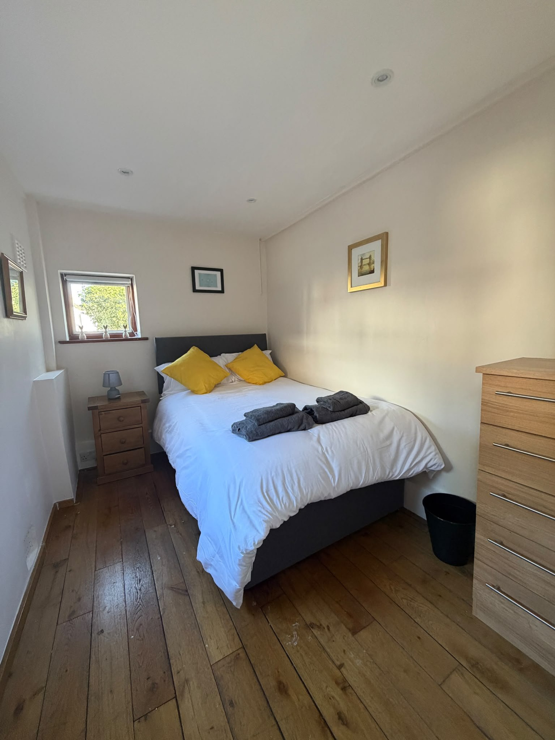 Bedroom with yellow pillows