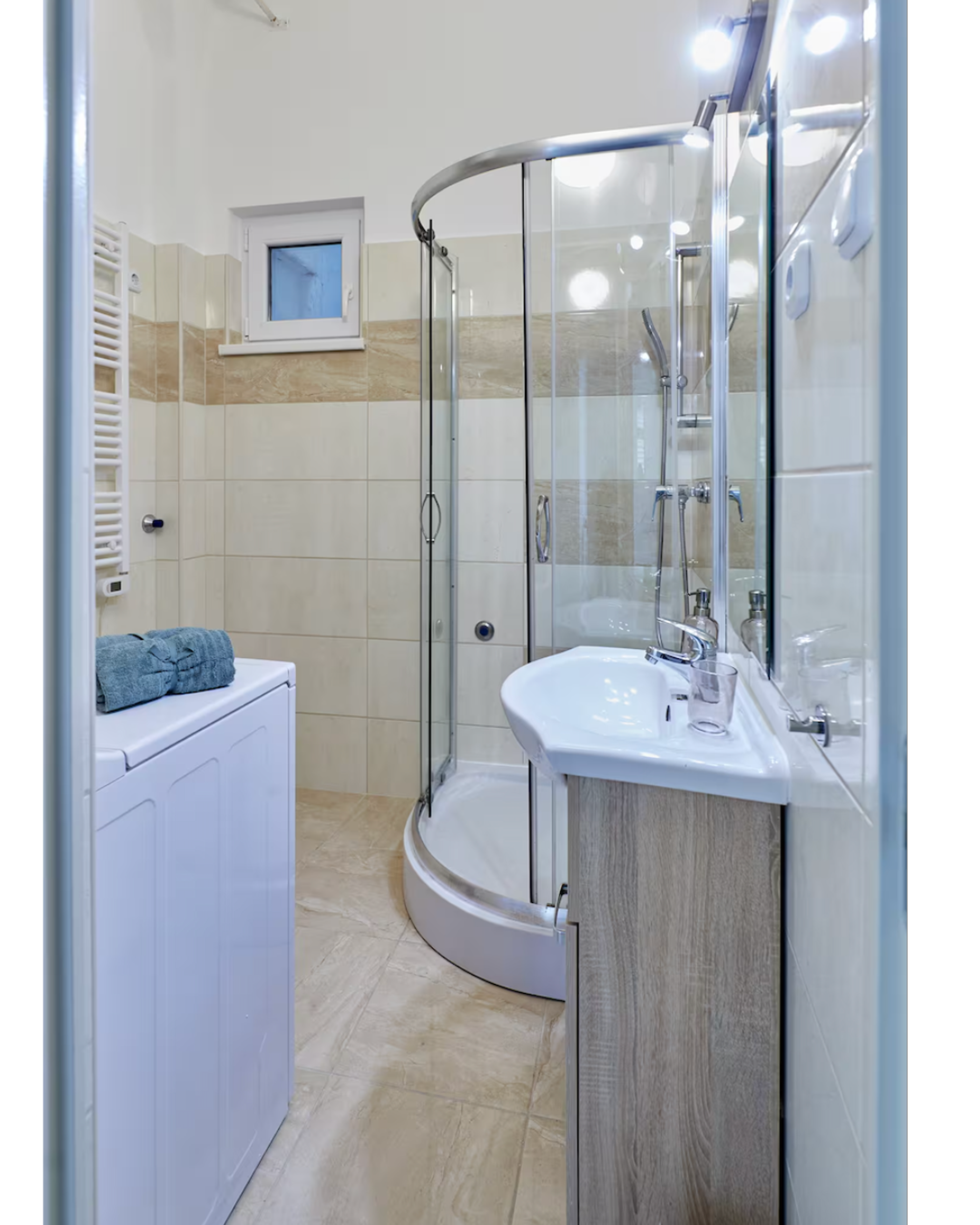Bathroom with shower and washer