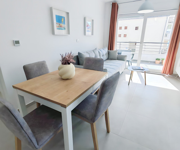 Dining and living area with balcony