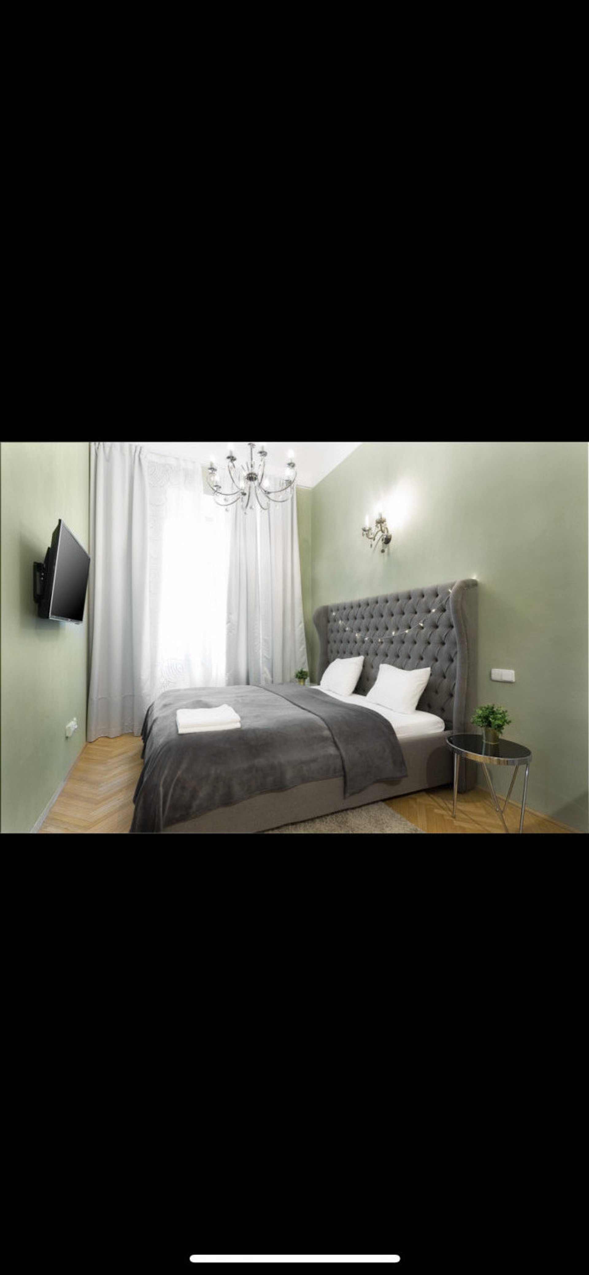 Cozy bedroom with green walls