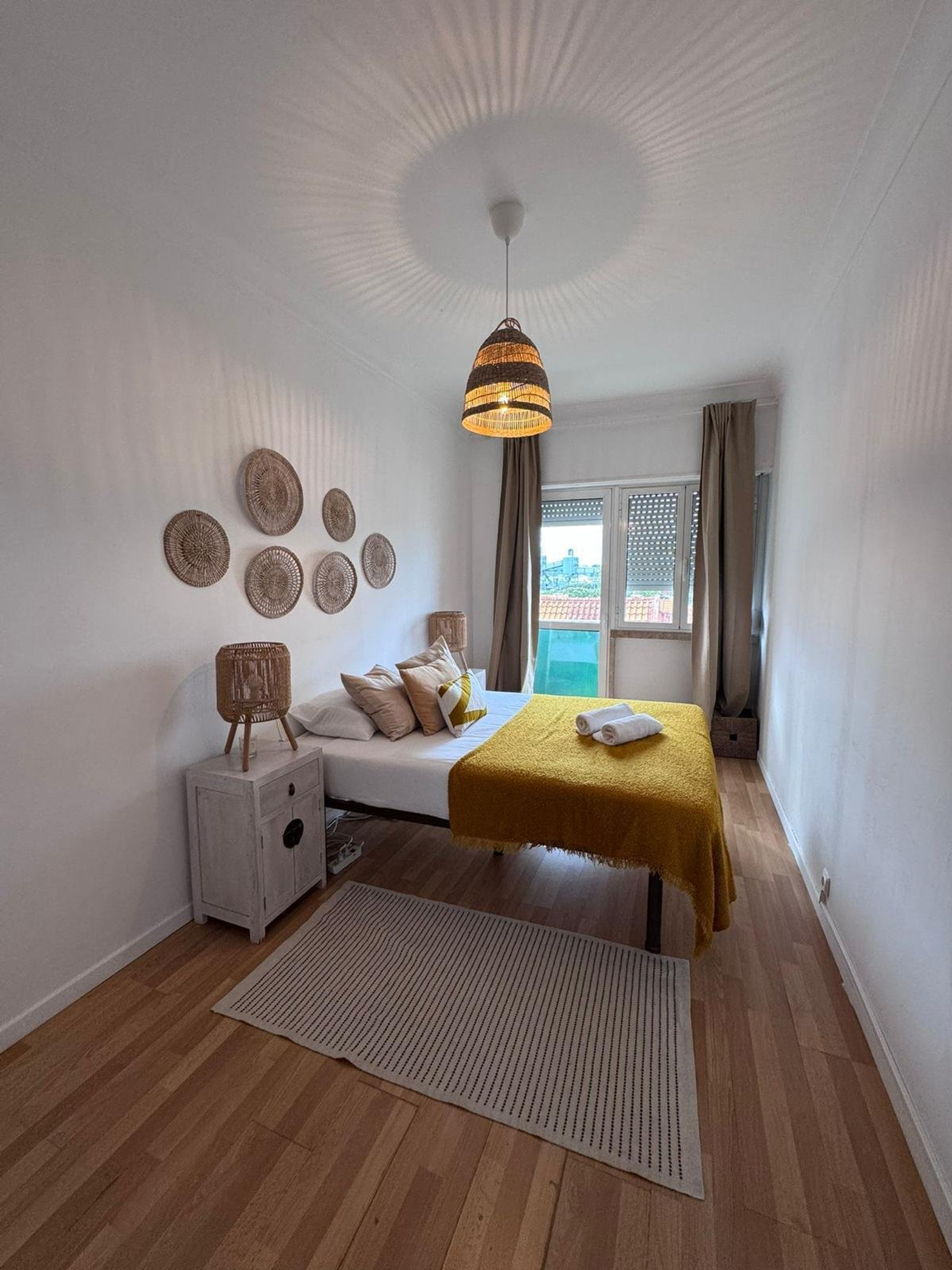 Bright bedroom with yellow blanket