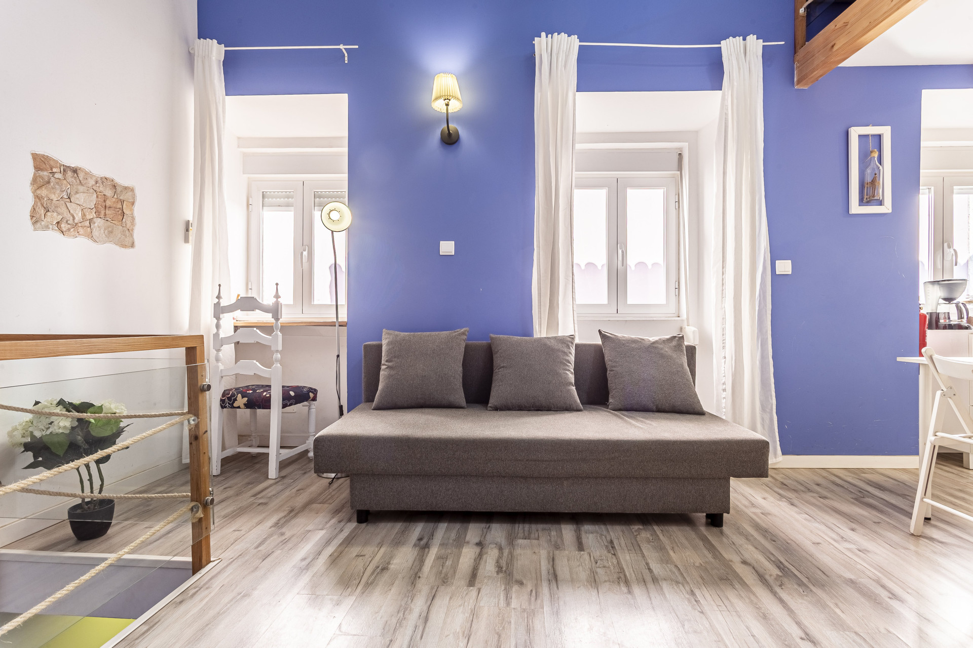 Grey sofa and windows