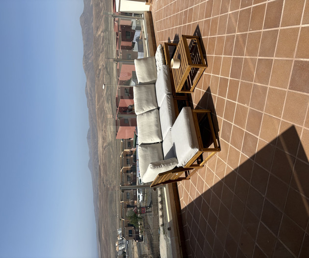 Terrace lounge seating with mountain view