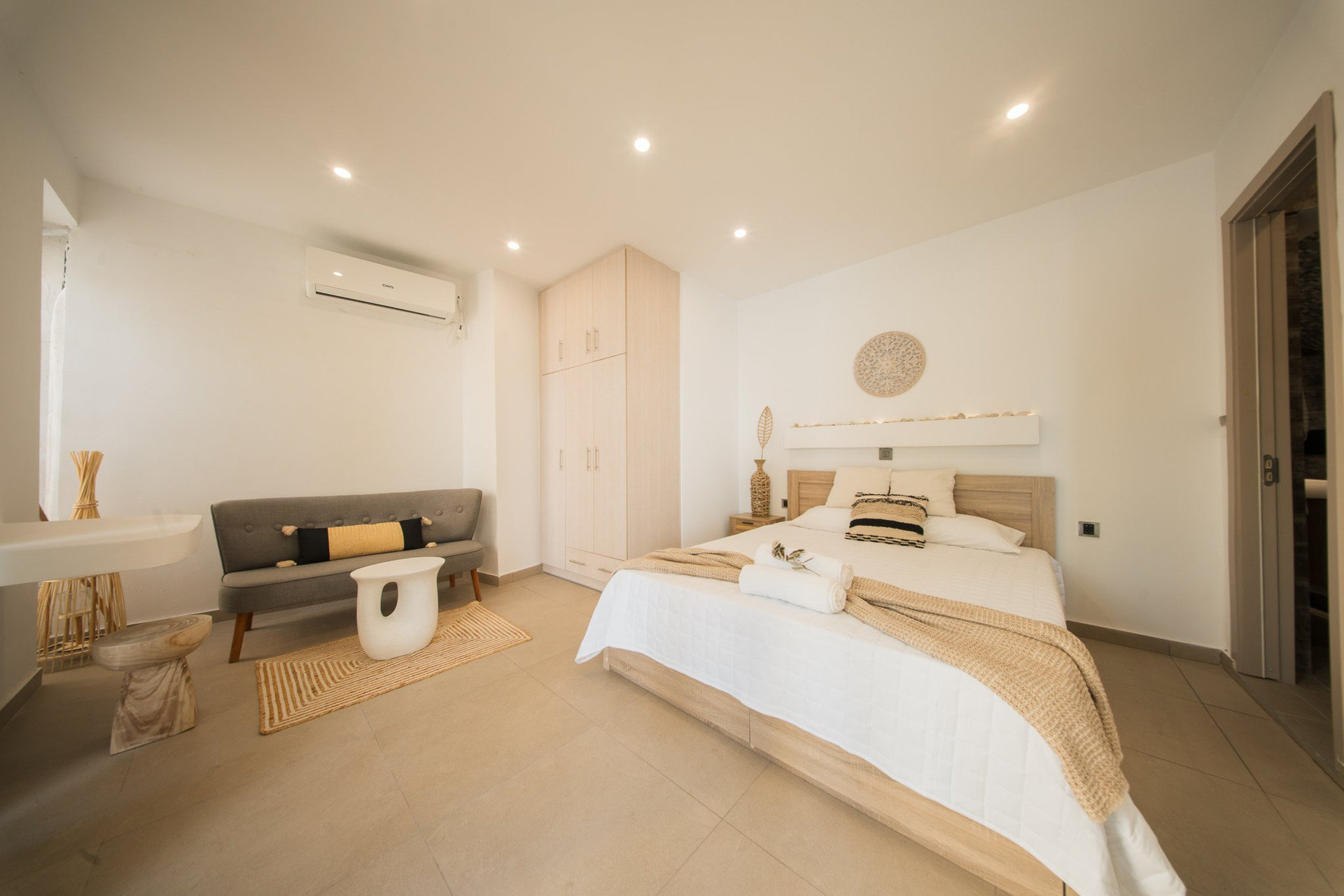 Bedroom with wardrobe and sofa
