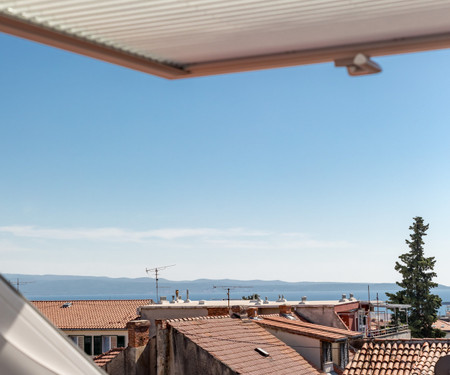 Sunny attic with sea view