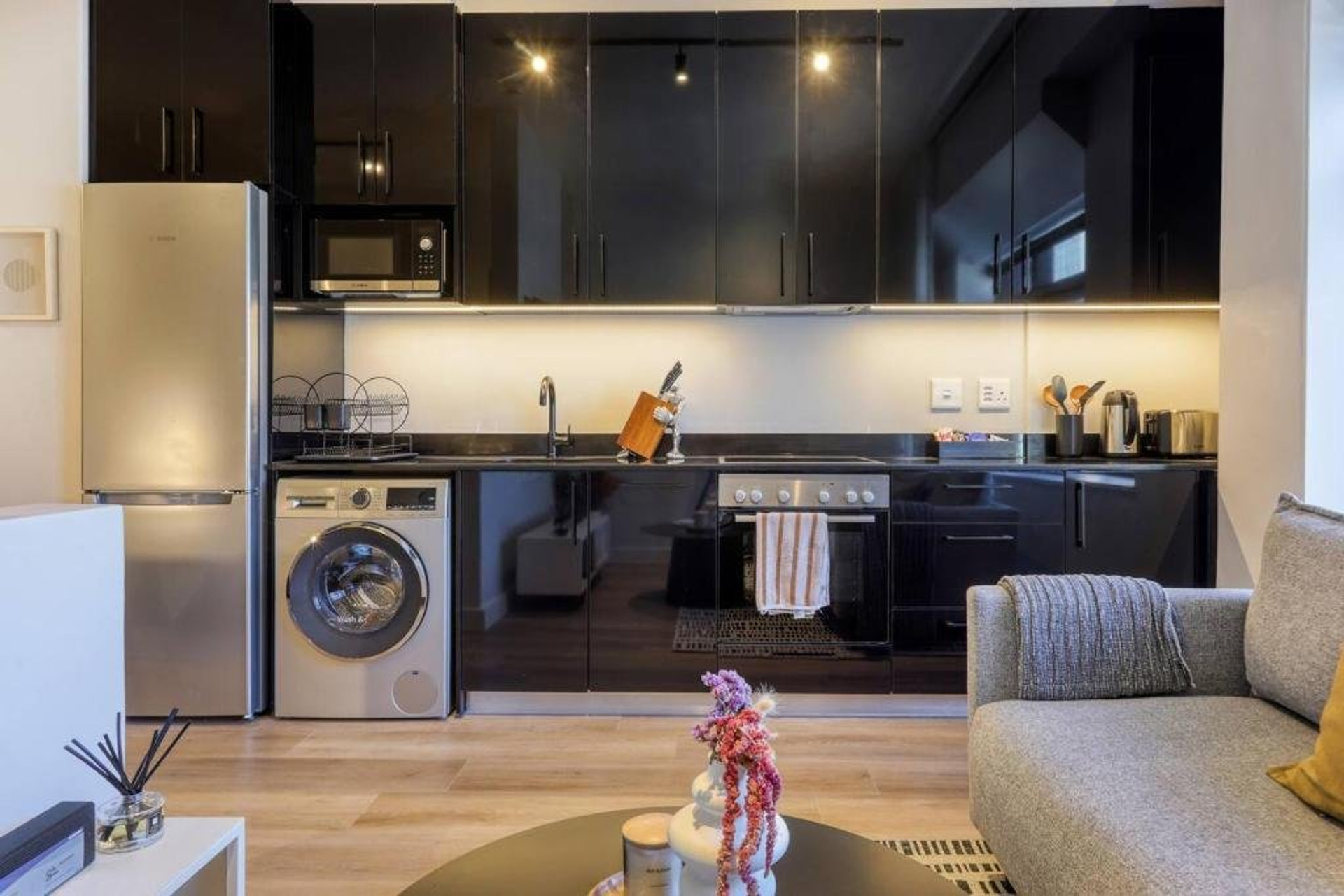 Modern black kitchen with appliances