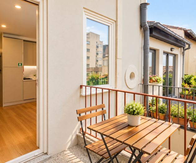 Balcony with bistro table and plants