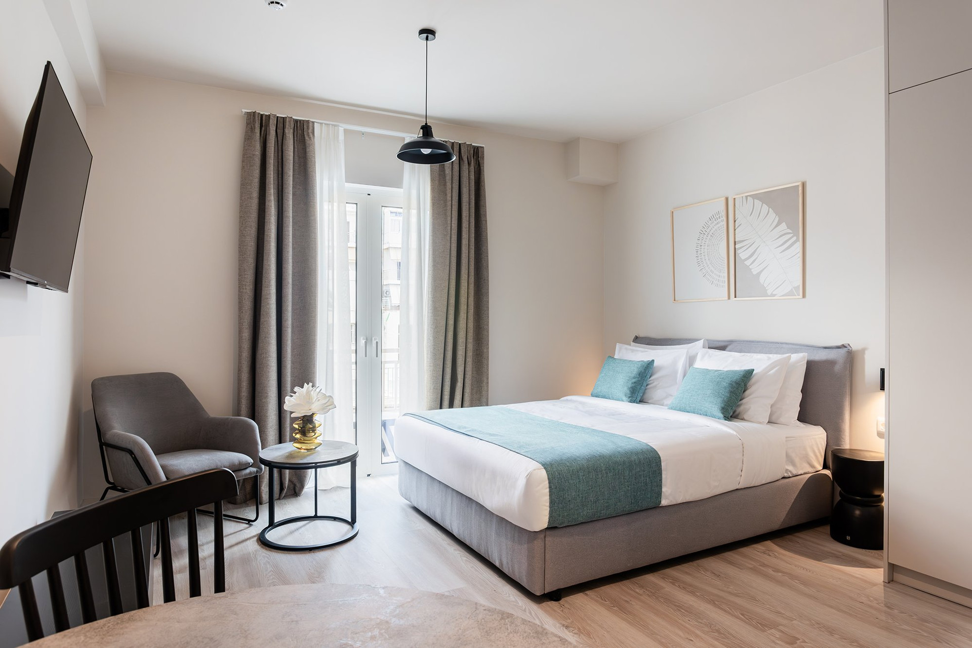 Spacious studio bedroom with balcony