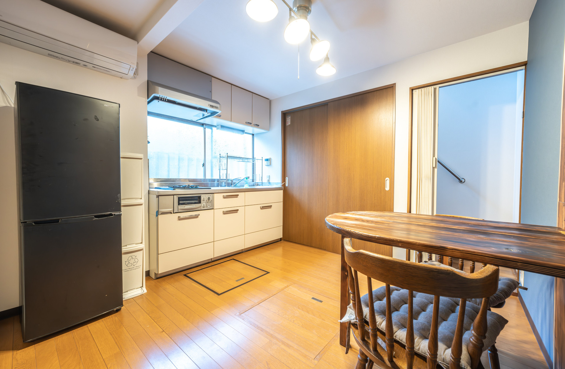 Kitchen with dining table and fridge