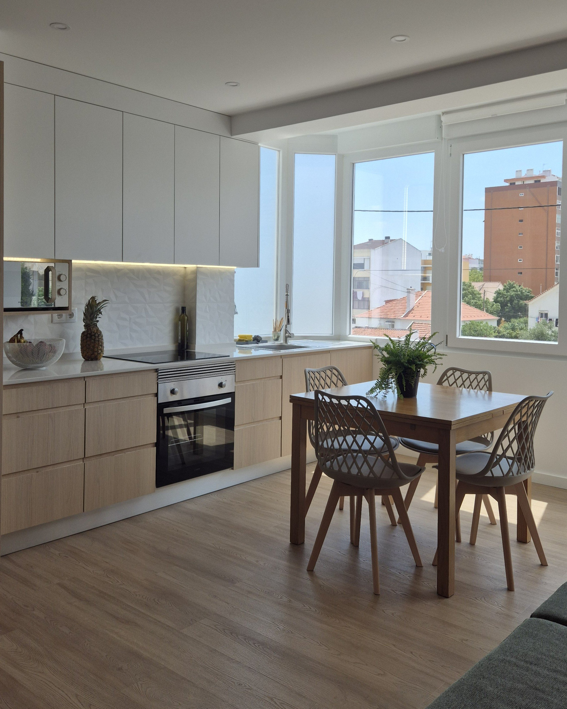 Kitchen and dining with large windows