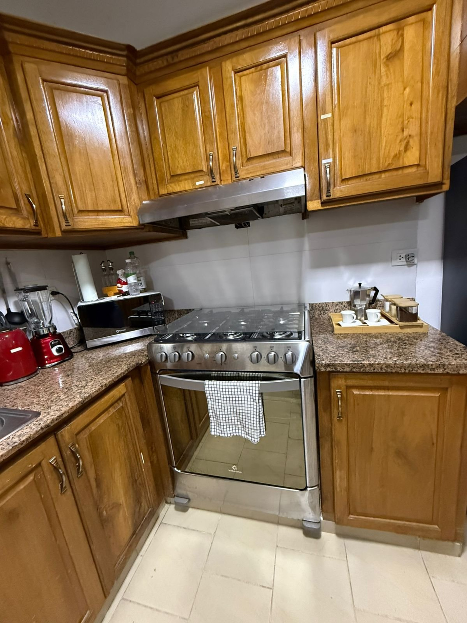 Kitchen with wood cabinets and stove