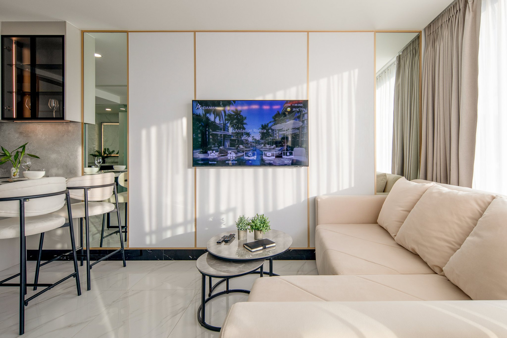 Bright living room with sofa and TV