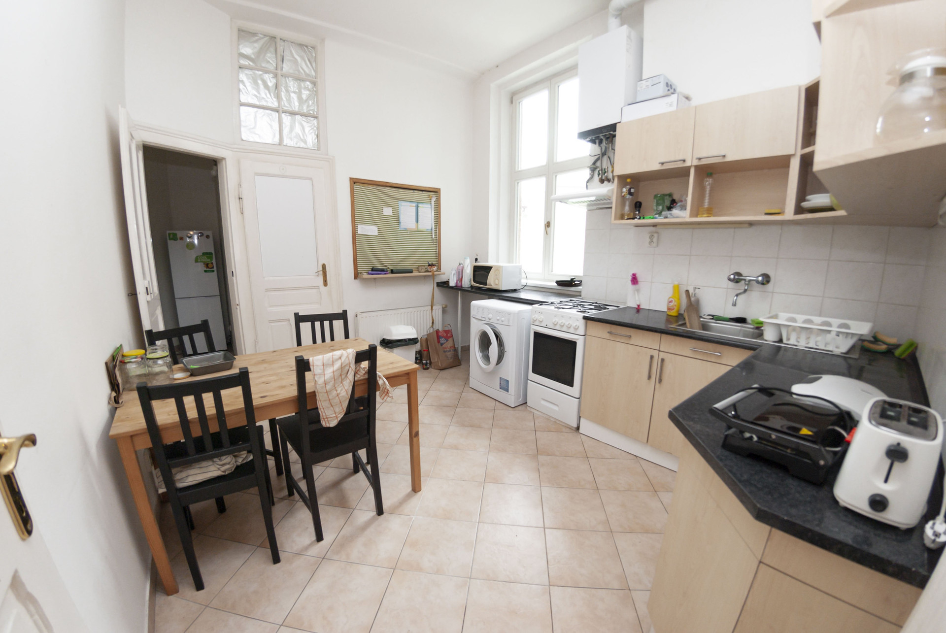 Kitchen with dining table and appliances