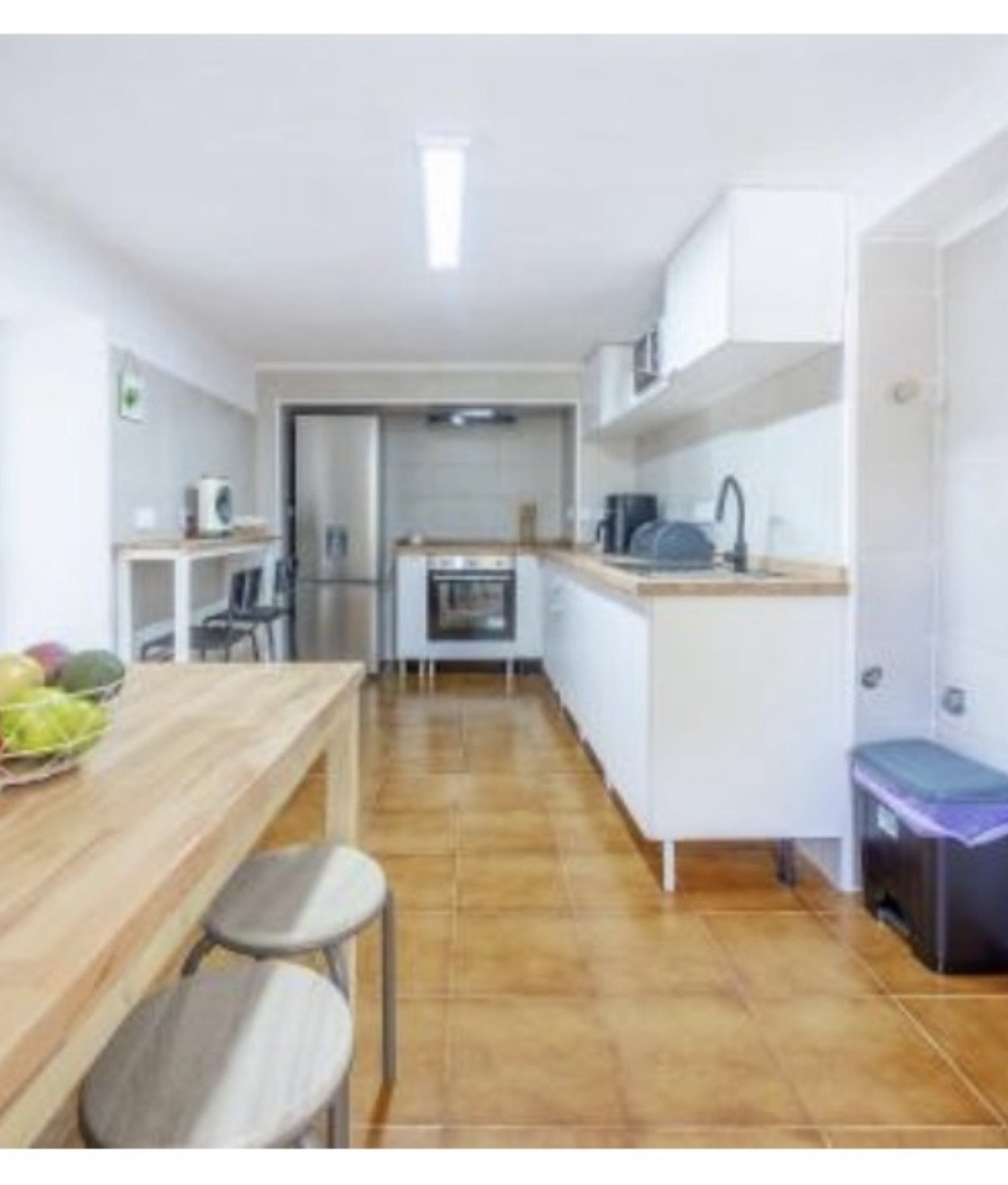 Bright kitchen with white cabinets