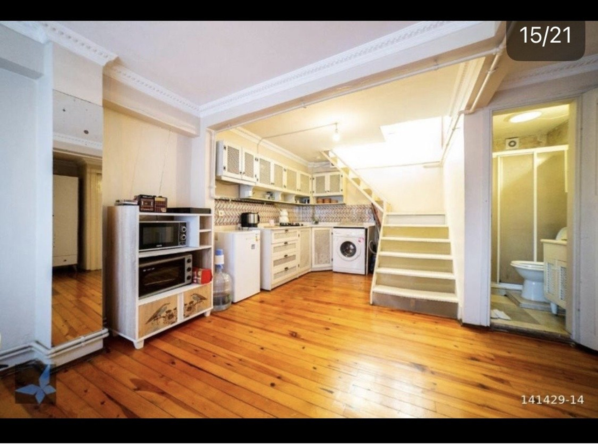 Kitchen with staircase and bathroom