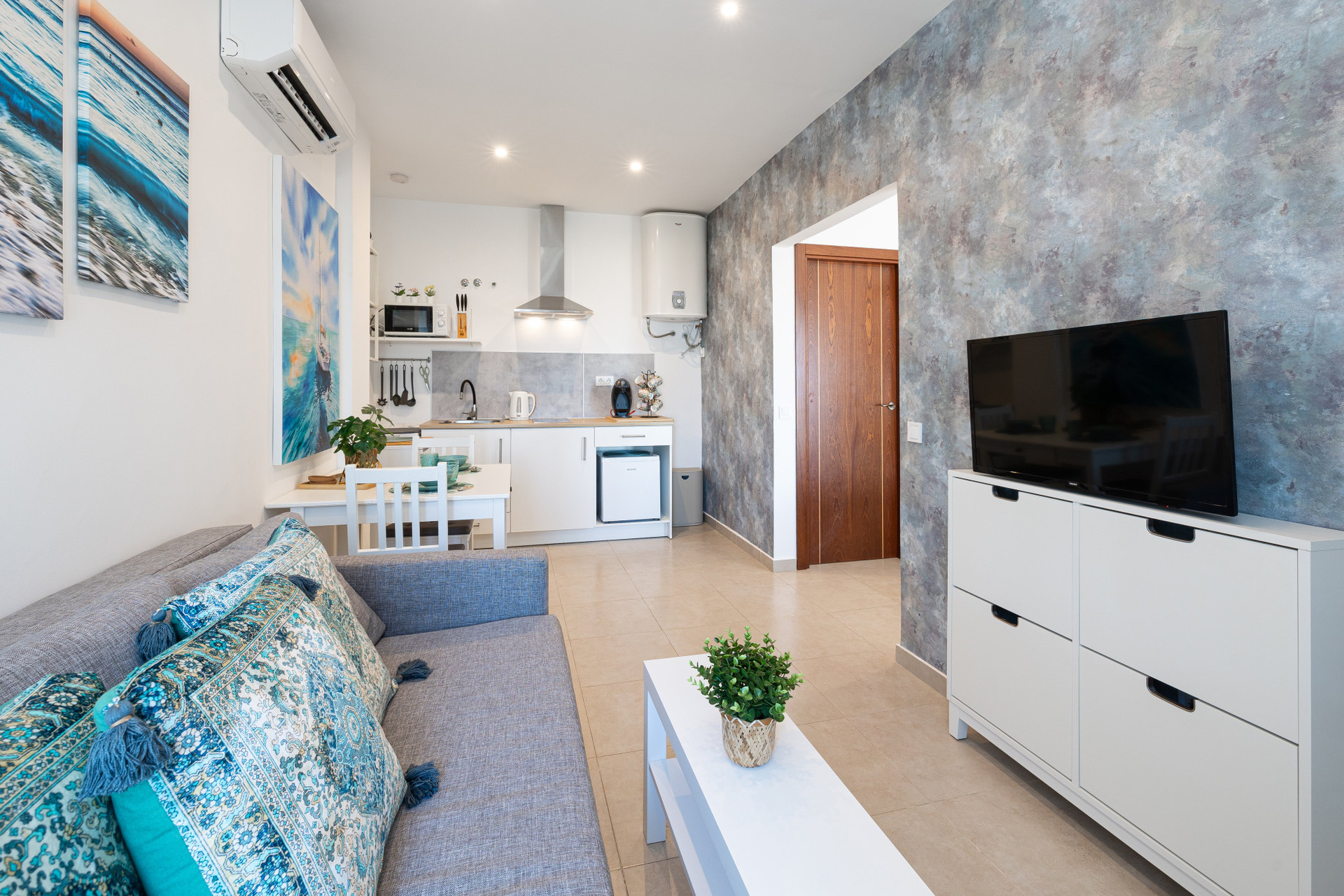 Living room with TV kitchen