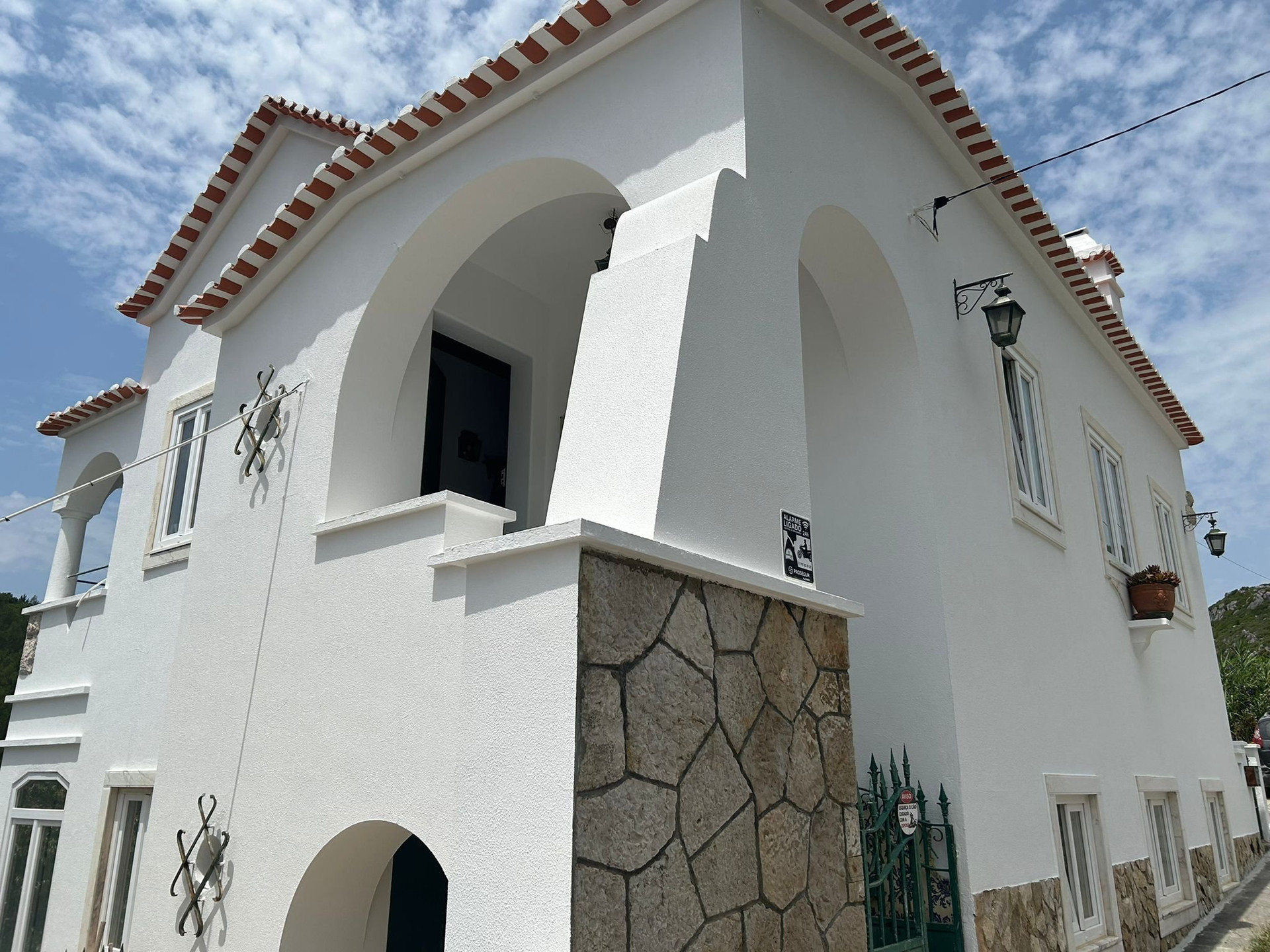 White villa exterior with arched entrance