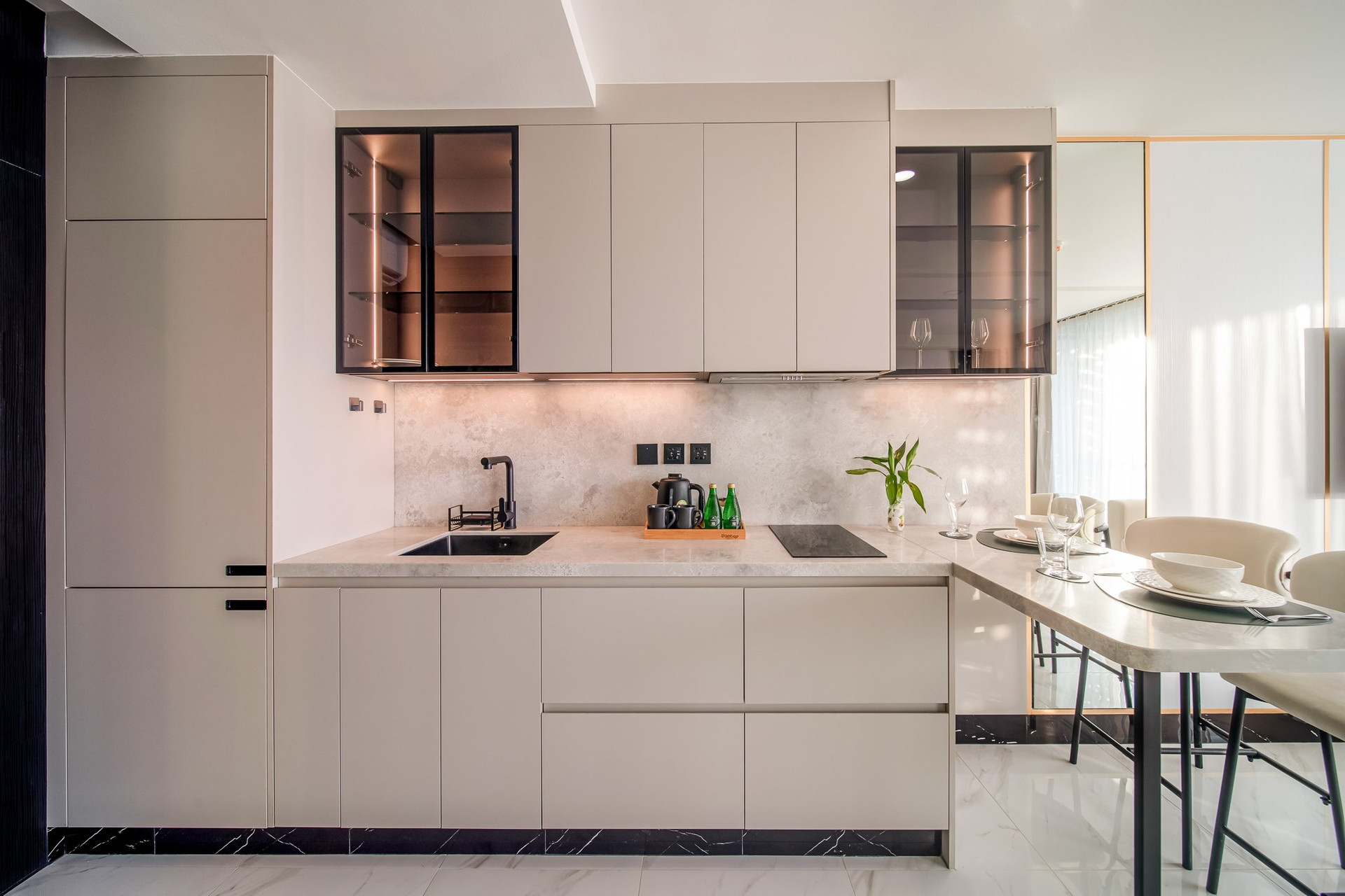 Sleek white kitchen with marble countertops