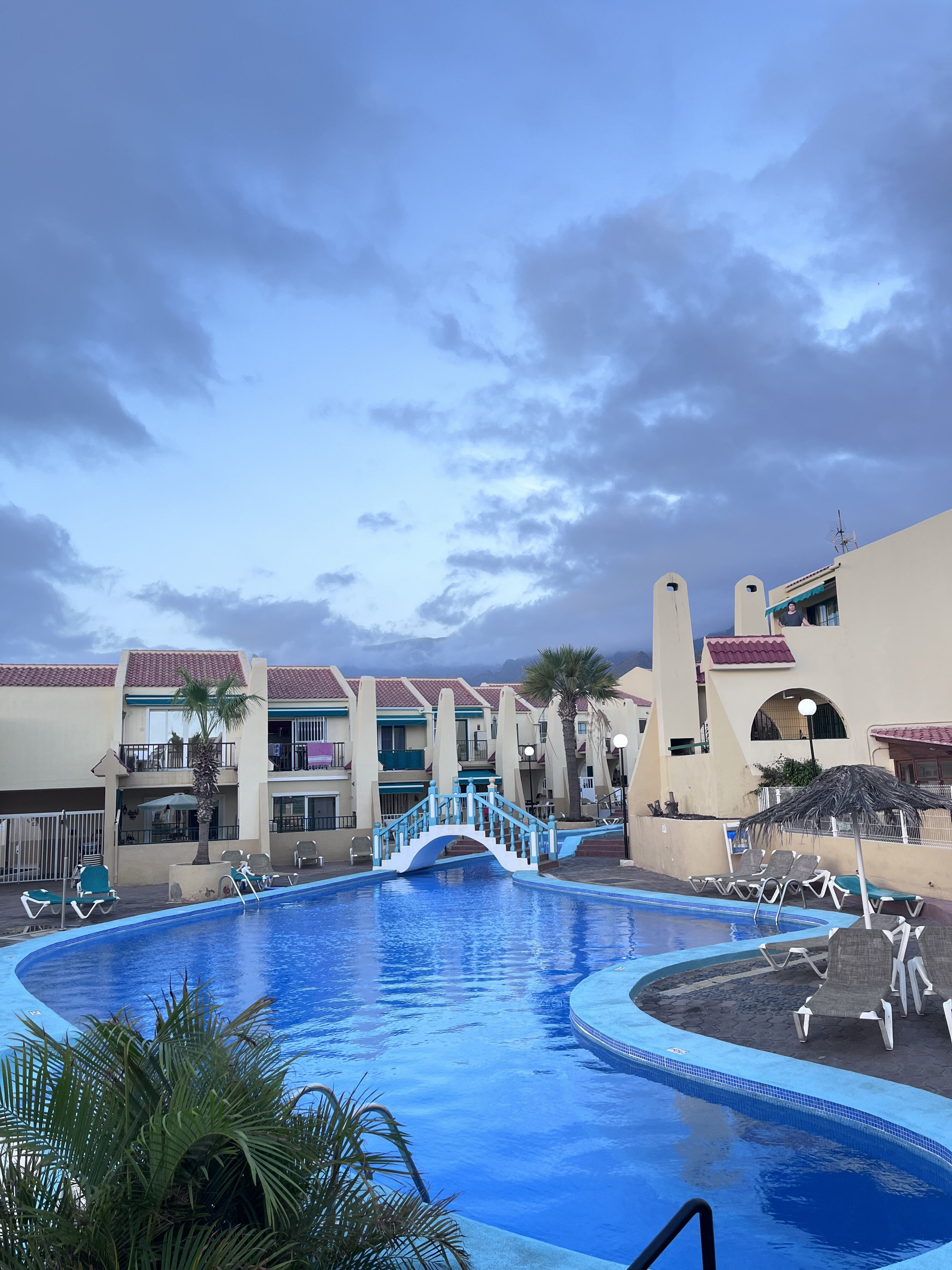 Curved pool and surrounding apartments