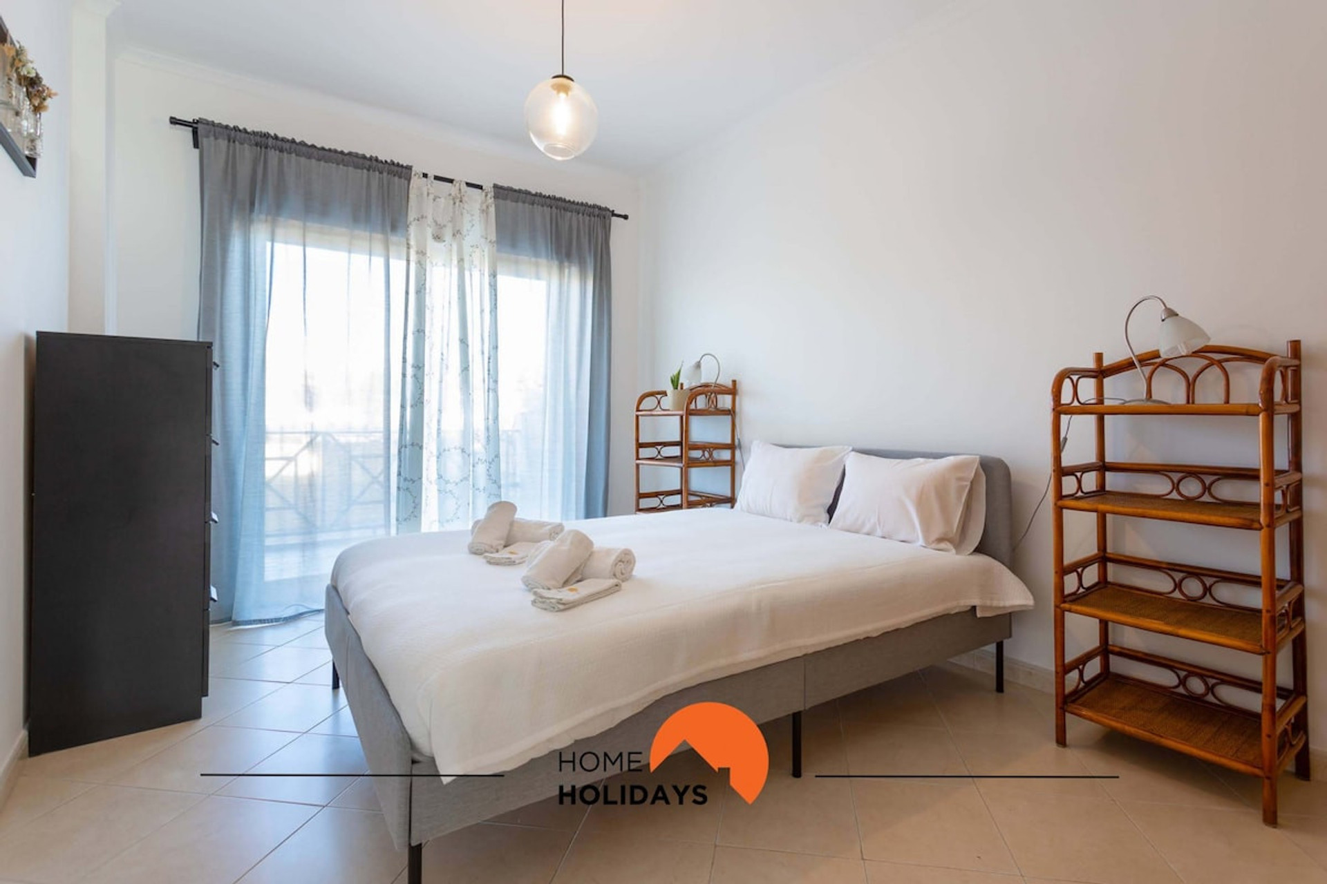 Room with a double bed and balcony access