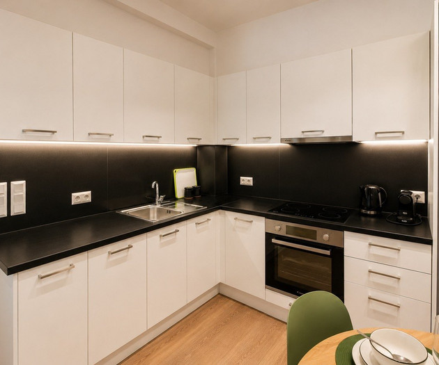 Modern kitchen with black countertops