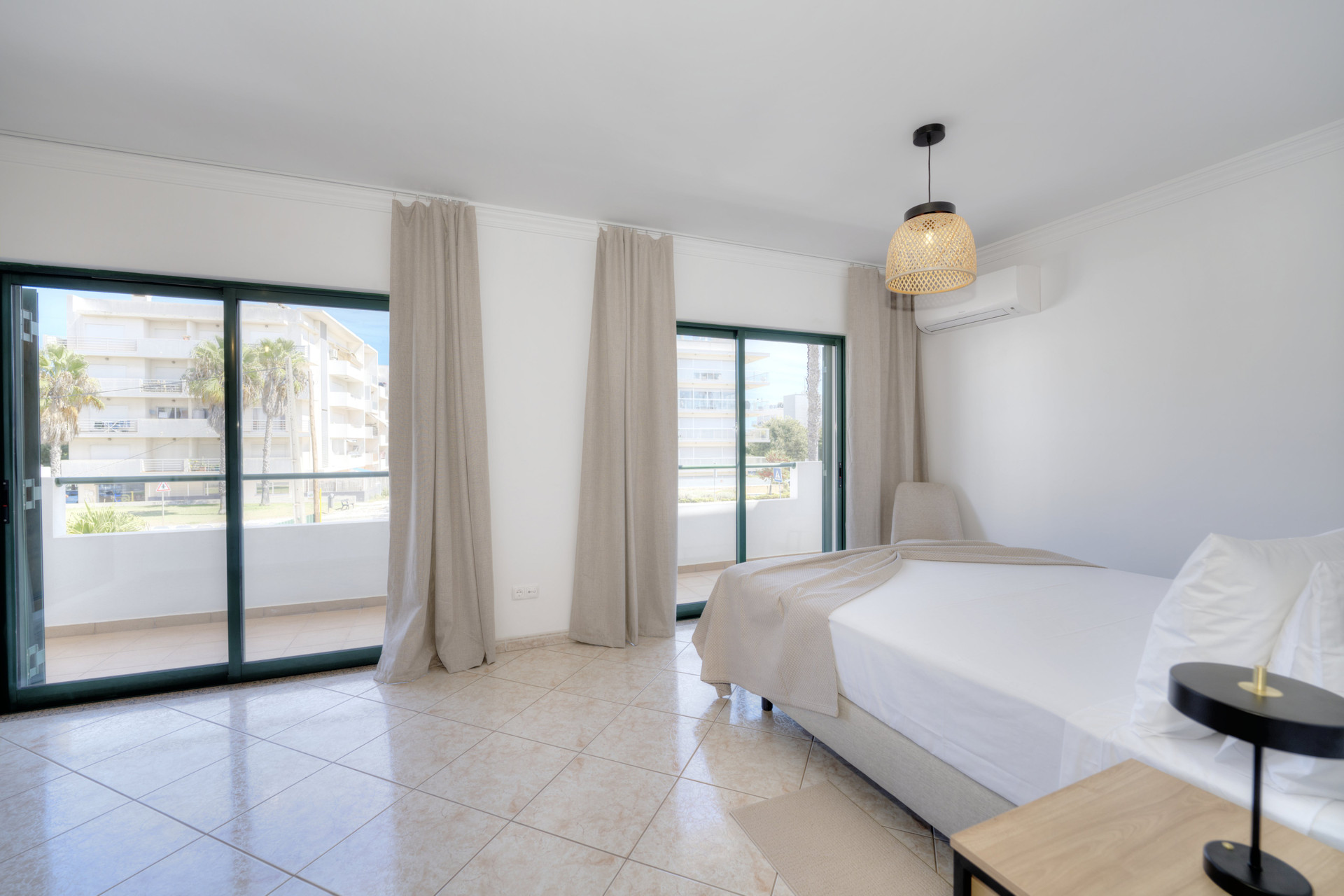Bedroom with balcony and double doors