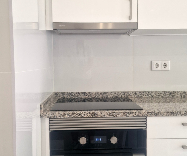 Kitchen with built-in oven and stove