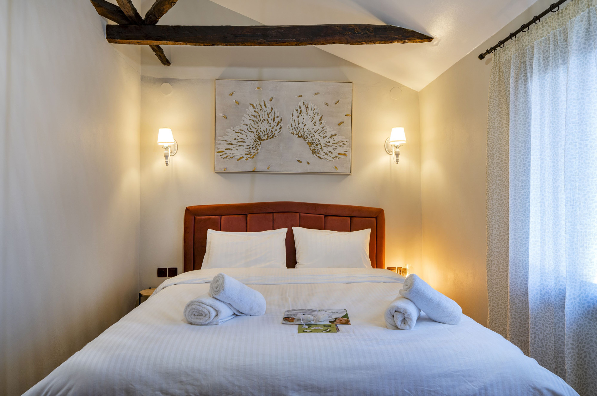 Elegant bedroom with orange headboard