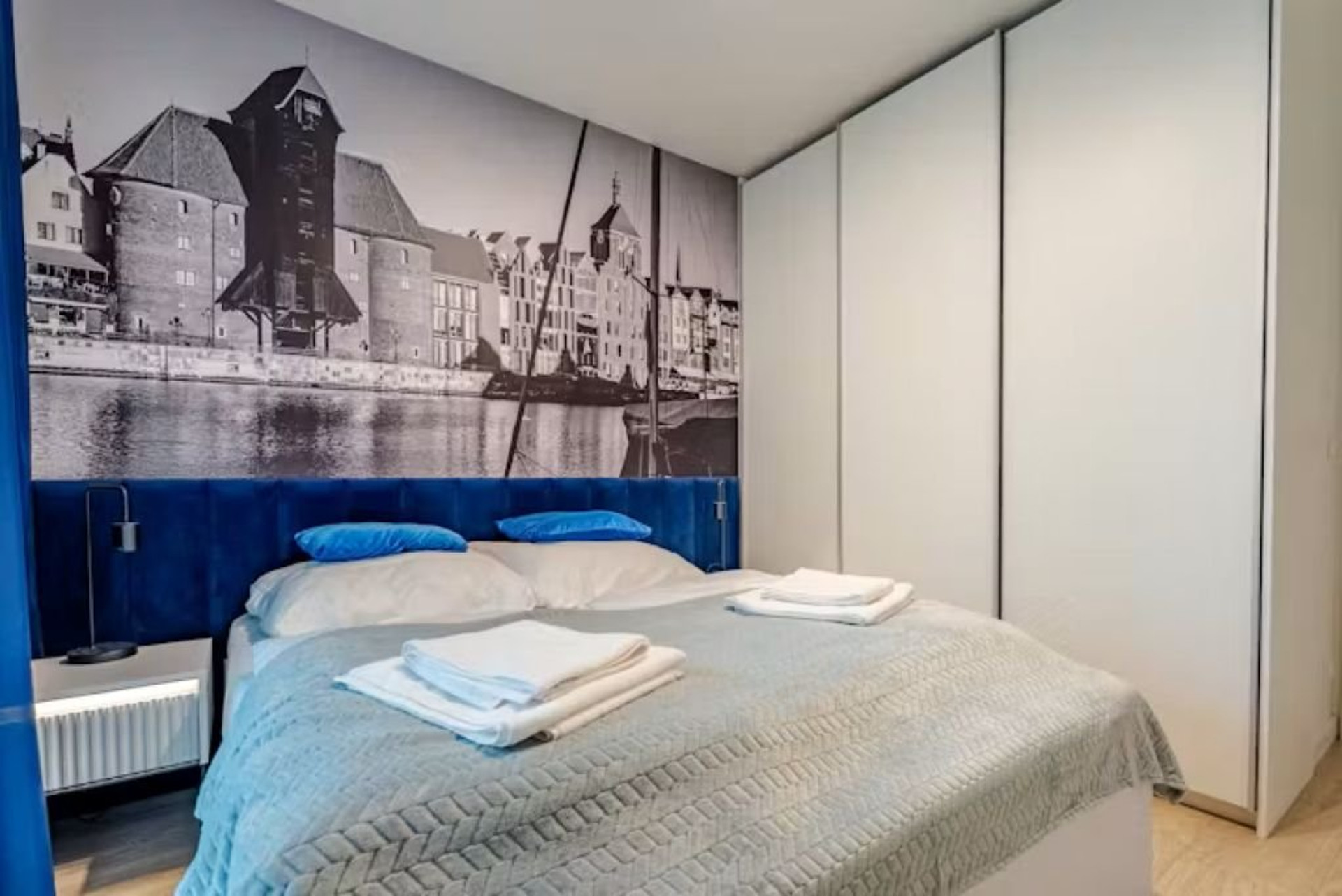 Bedroom with wardrobe and bedding