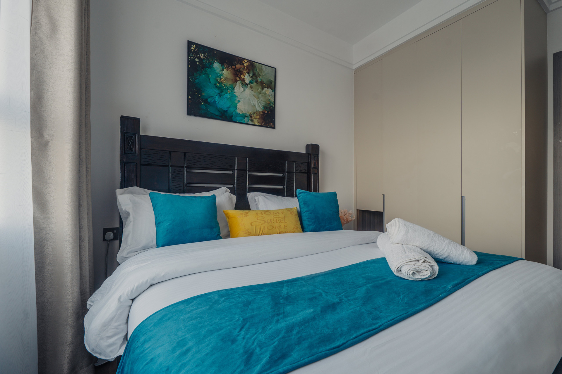 Master bedroom queen size bed and wardrobe