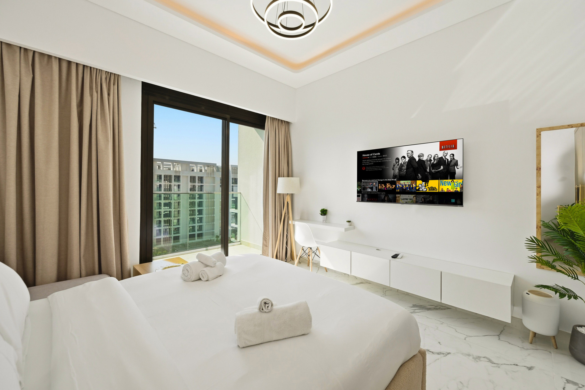 Bedroom with TV and balcony