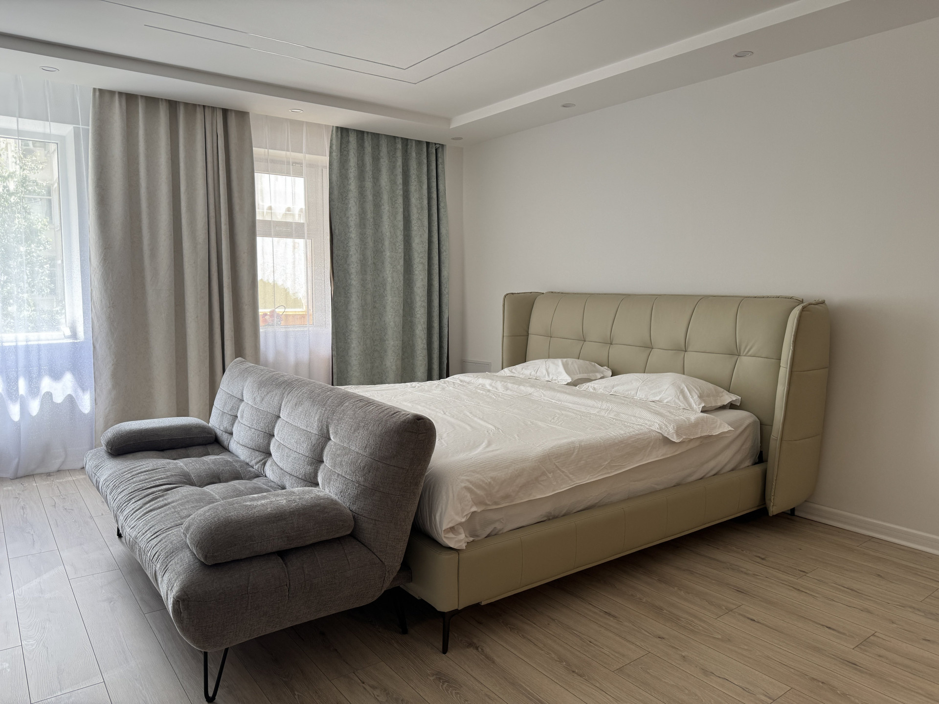 Bedroom with bed and sofa