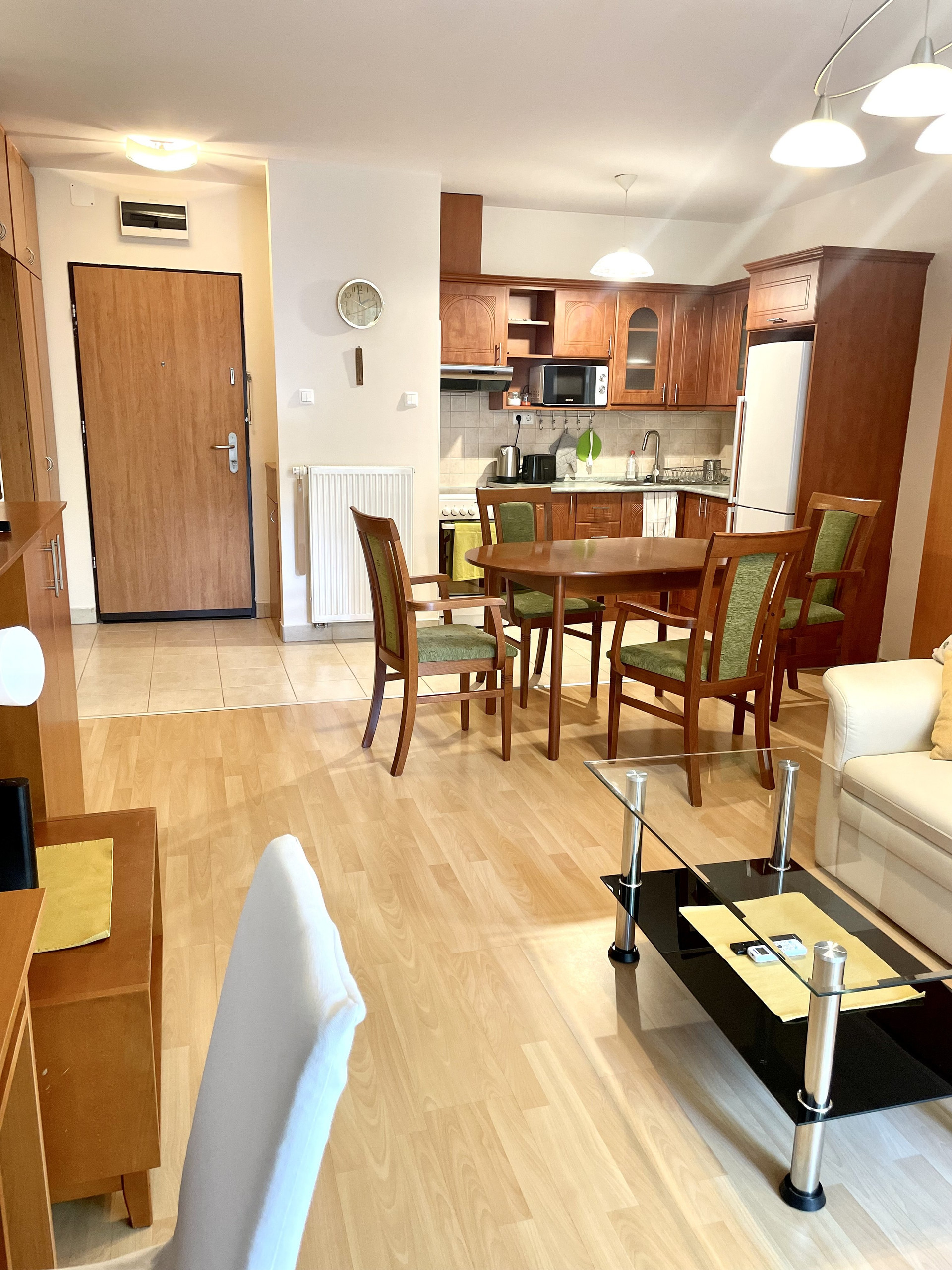 the entrance of the flat and the kitchen