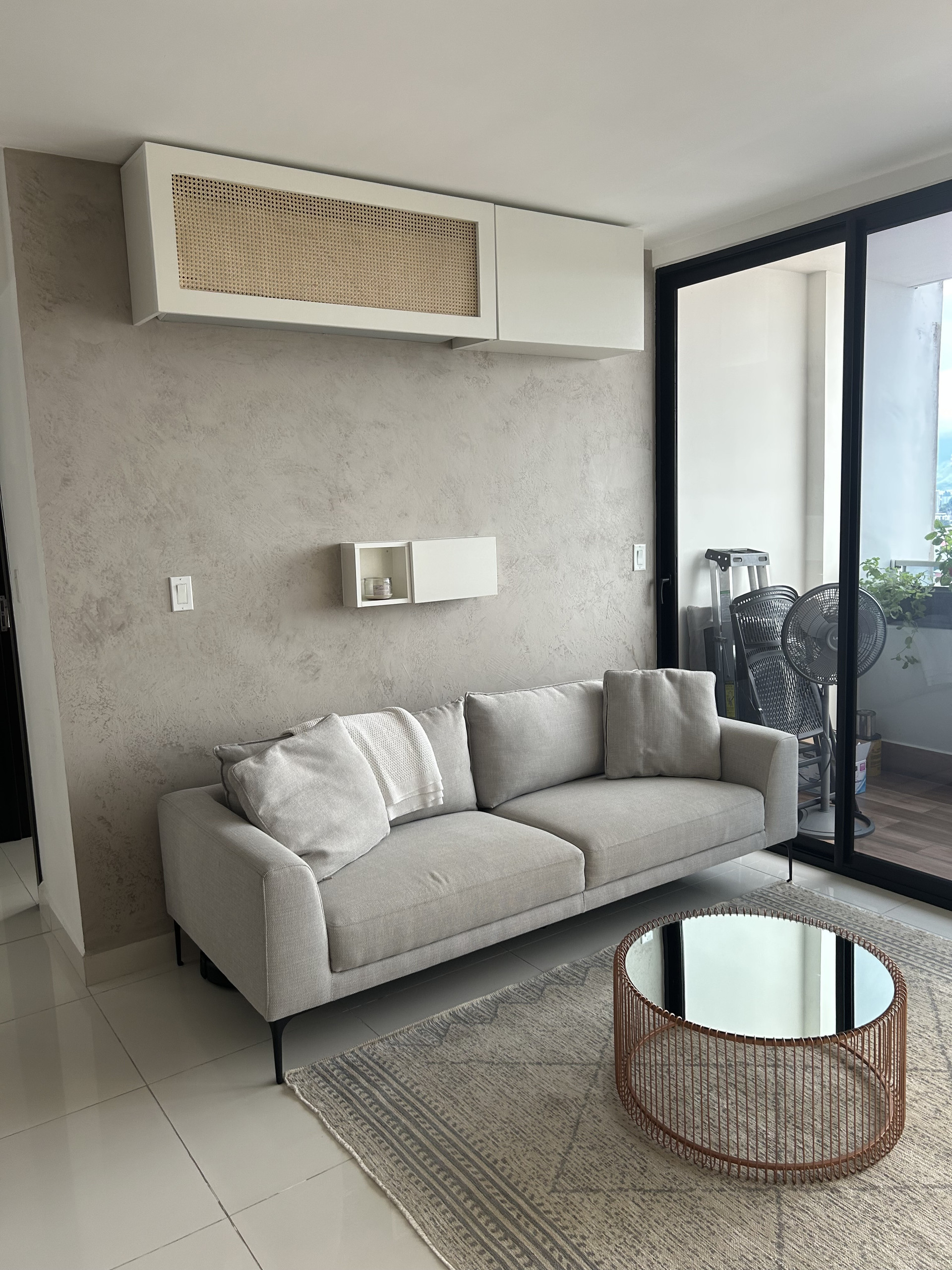 Living room sofa with balcony access