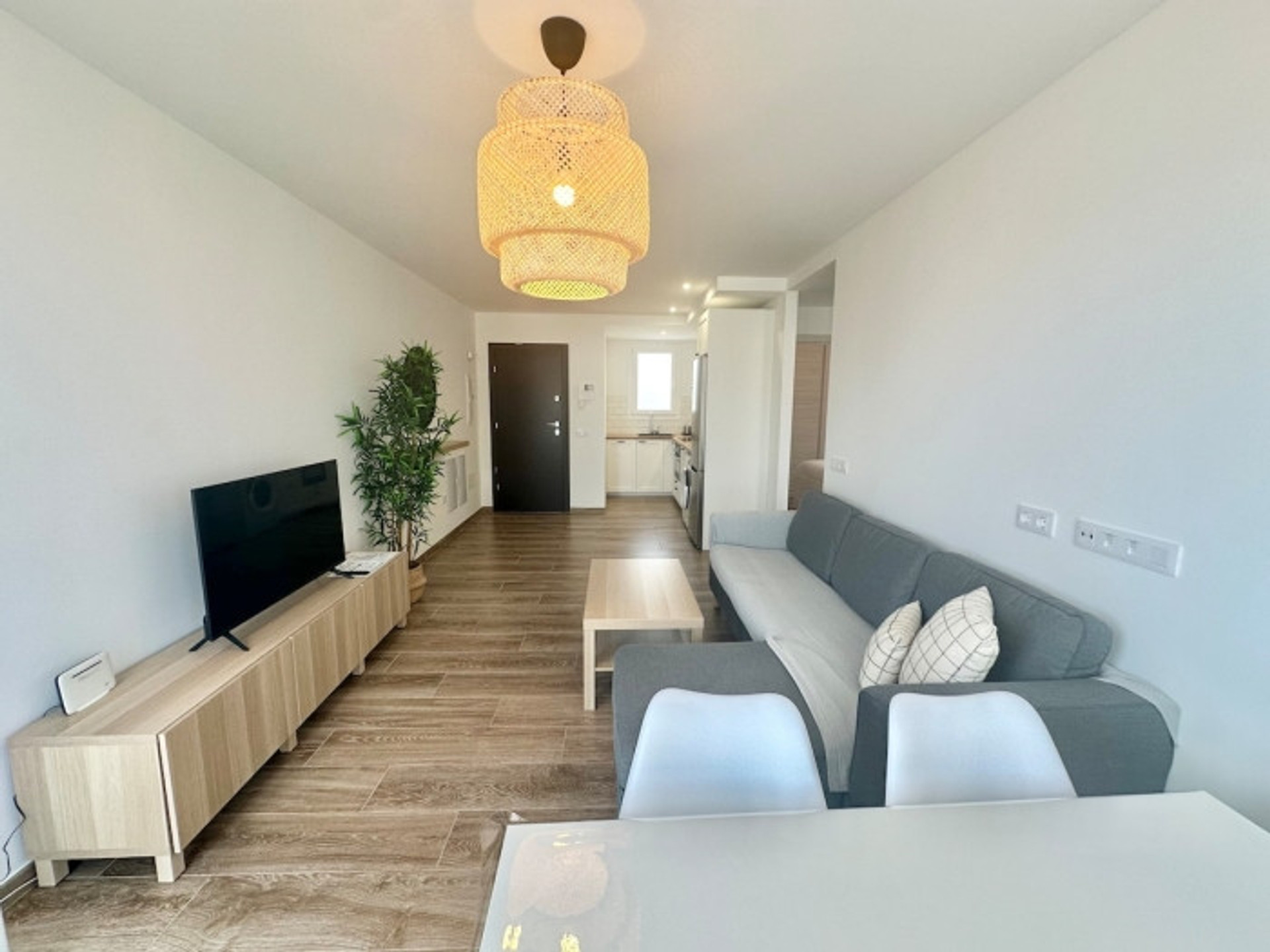 Open living room with sofa and TV