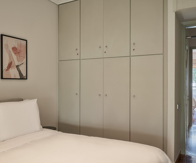 The first bedroom with a double bed and the wardrobe