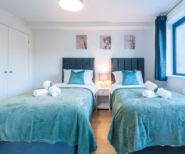 Twin bedroom with wardrobe
