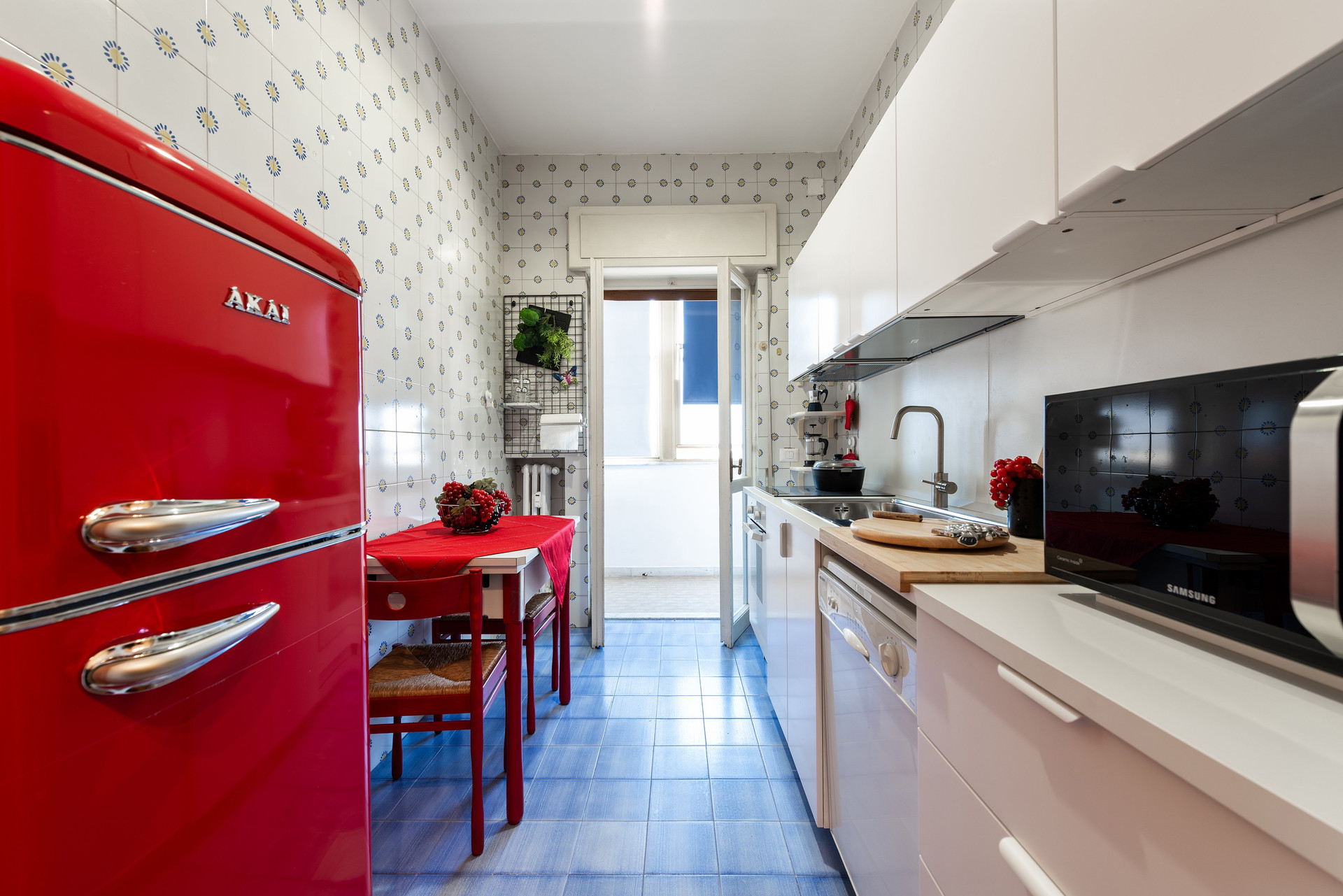 Kitchen with red retro fridge