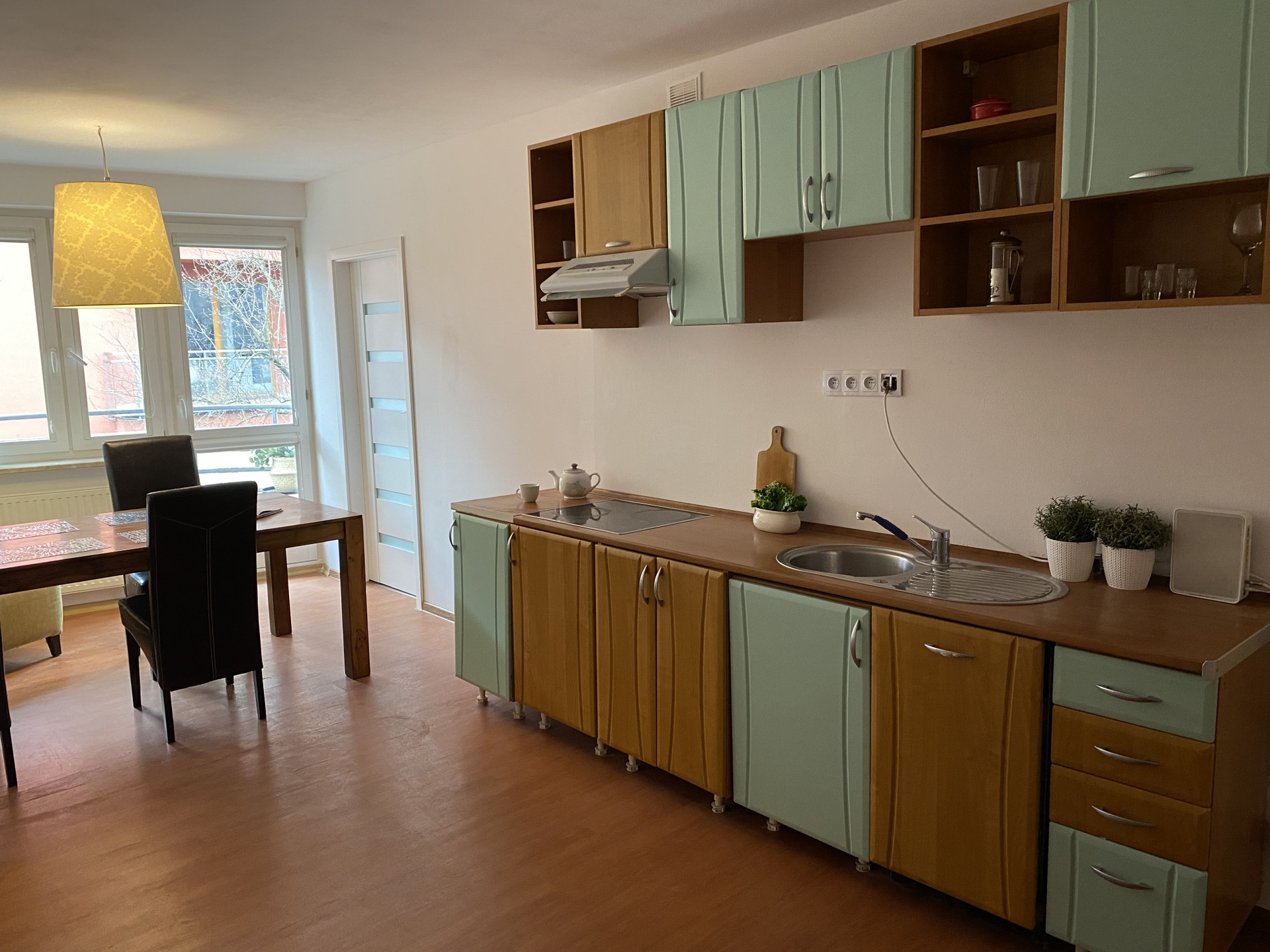 Kitchen with dining area and balcony