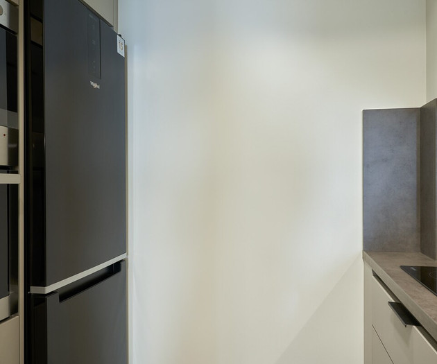 The kitchen's fridge and oven