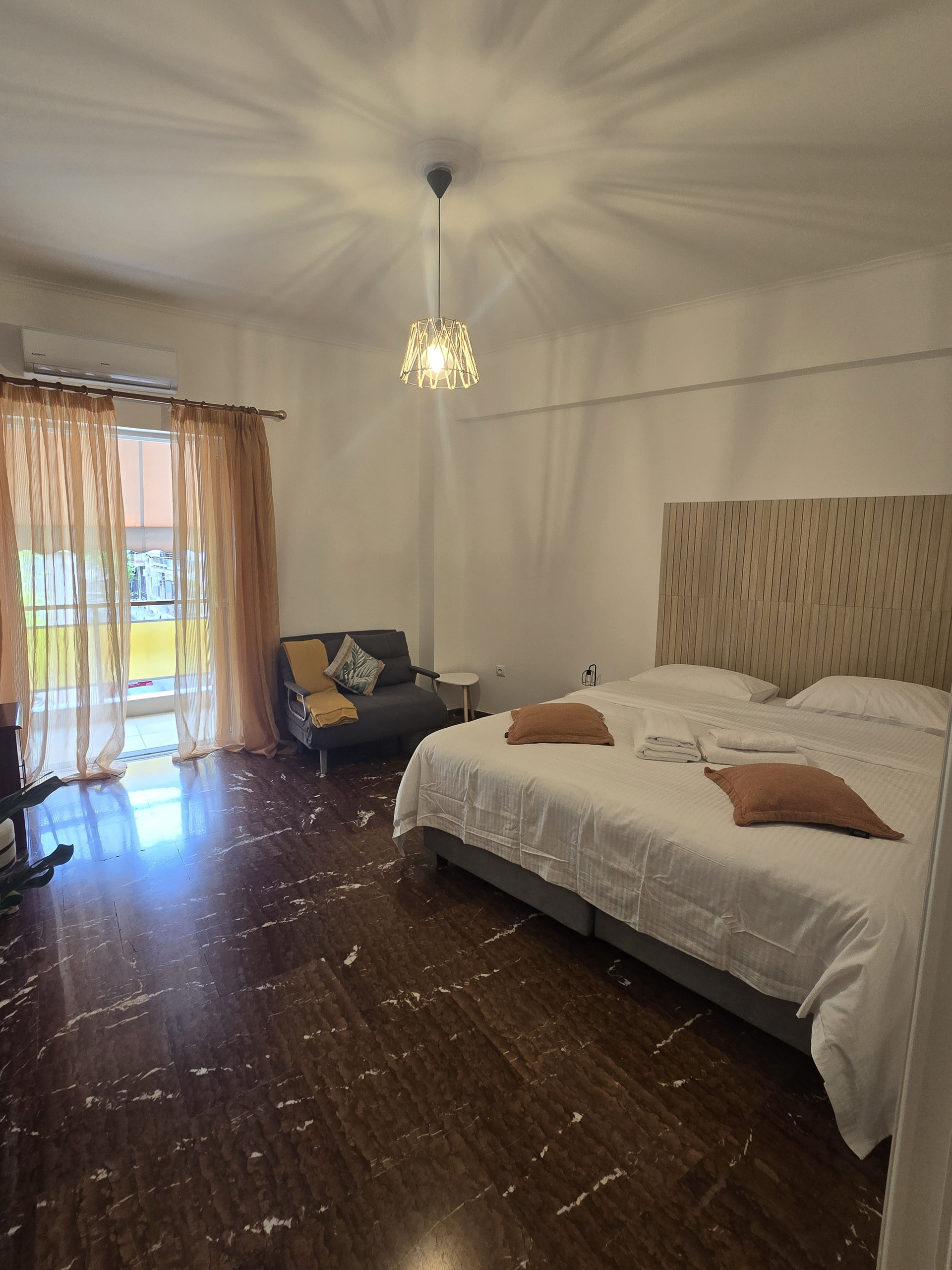 Bedroom with double bed and sofa