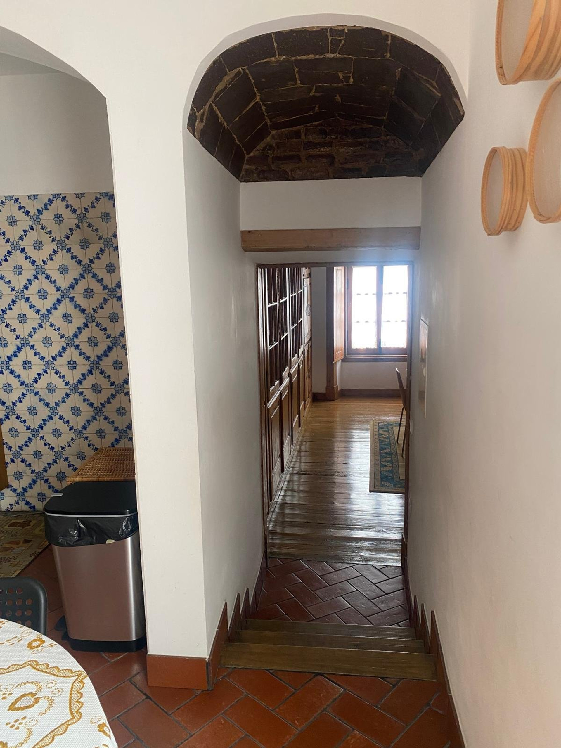 Arched hallway with stone ceiling detail
