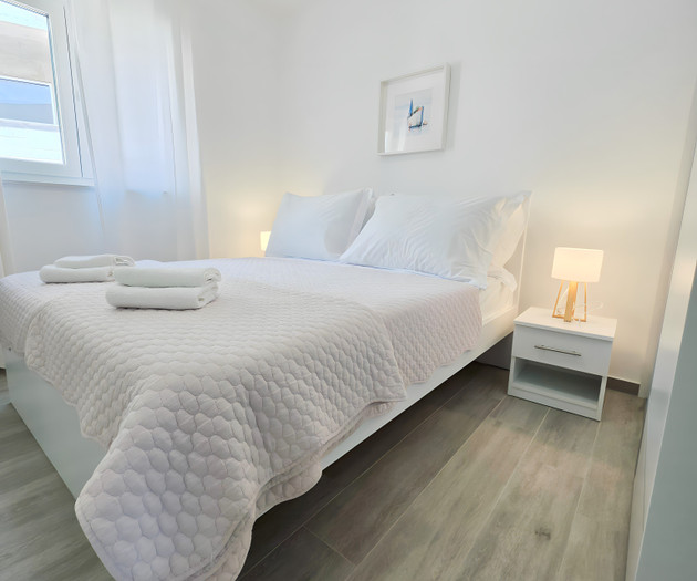 Cozy bedroom with white bedding